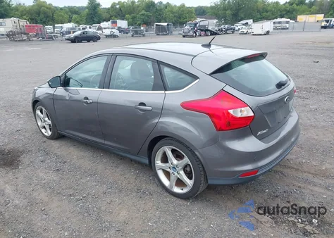 2012 Ford Focus Titanium z USA, uszkodzony, nr VIN 1FAHP3N21CL433734